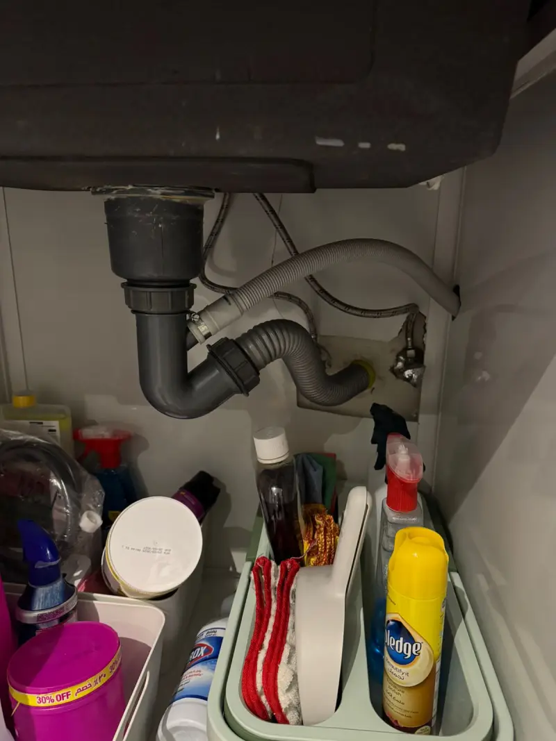 Sink drain trap replaced by a plumber in Riyadh